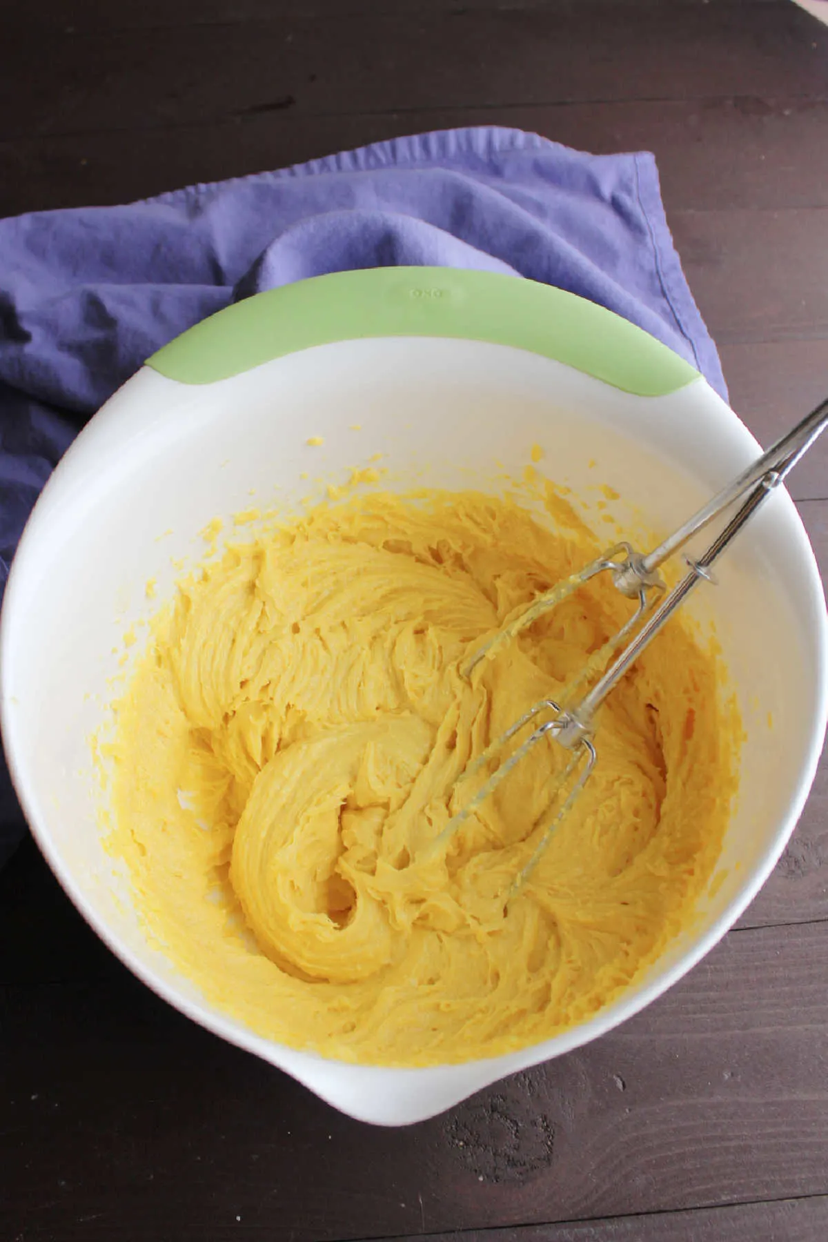 lemon whoopie pie batter in mixing bowl with beaters.