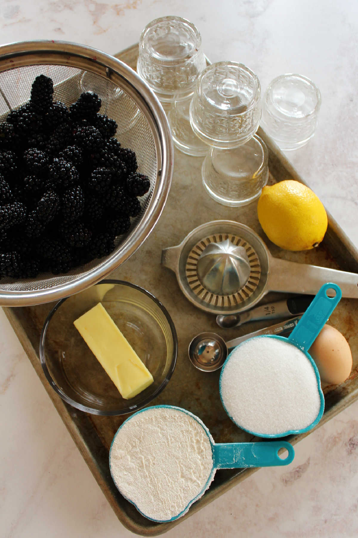 Tray of blackberry cobbler ingredients.