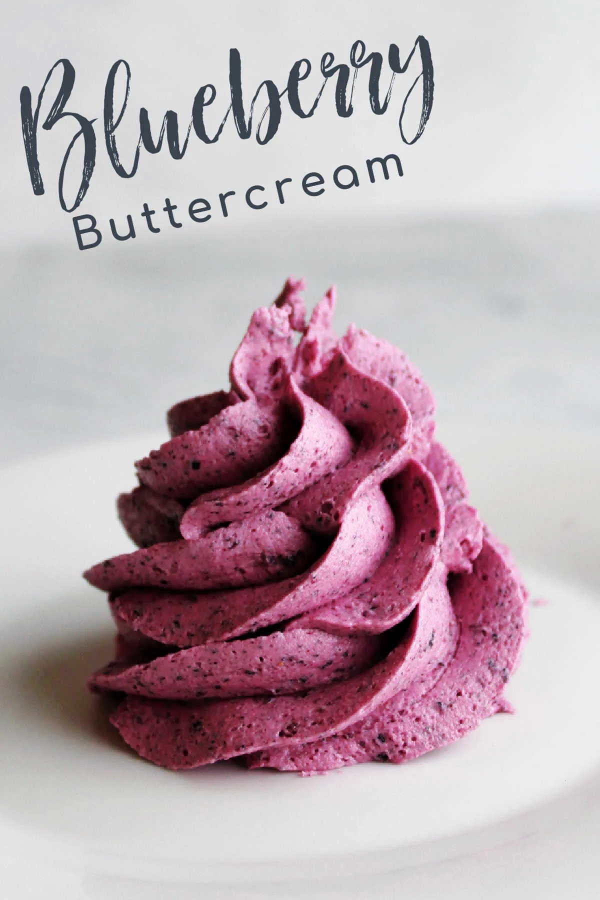 Bright blueberry buttercream is both colorful and flavorful. It is perfect for topping cakes, cupcakes, cookies and more!