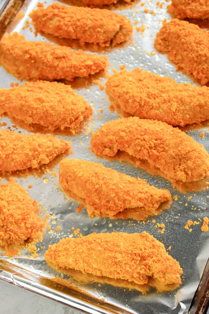 Freshly baked cheez-it chicken fingers fresh from the oven.
