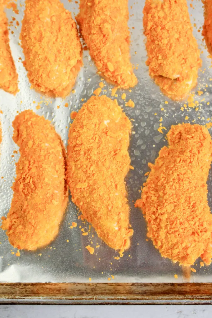 Cheese cracker coated chicken tenders ready to bake.