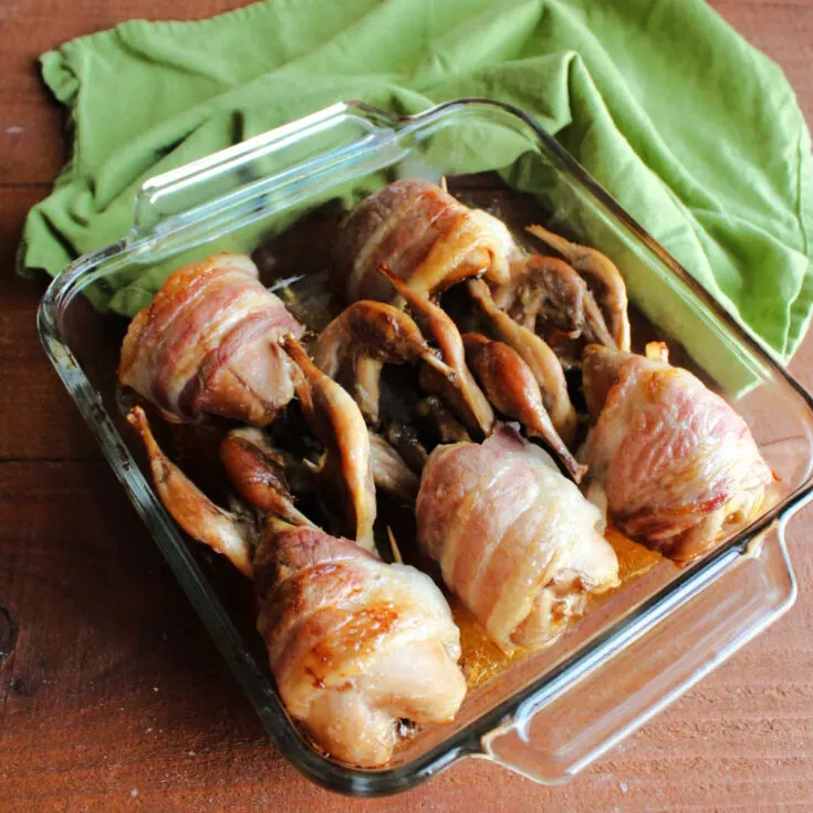 Roasted bacon wrapped quail fresh from the oven.