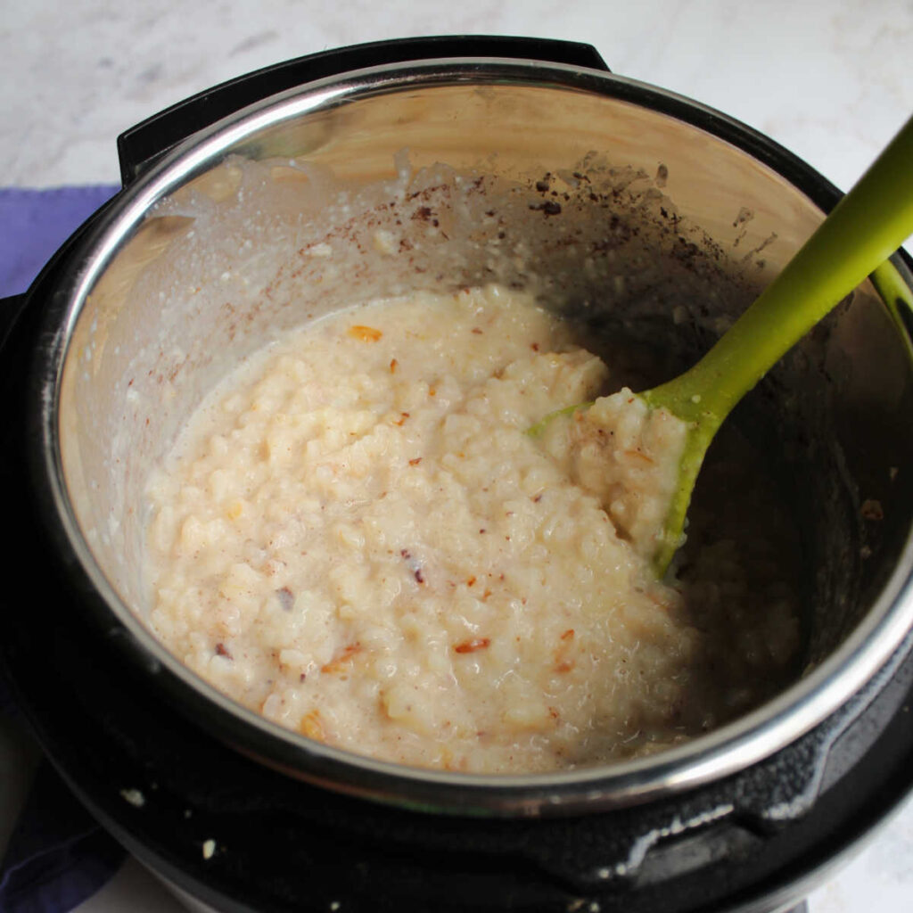 Creamy rice pudding in instant pot, ready to be served or chilled.