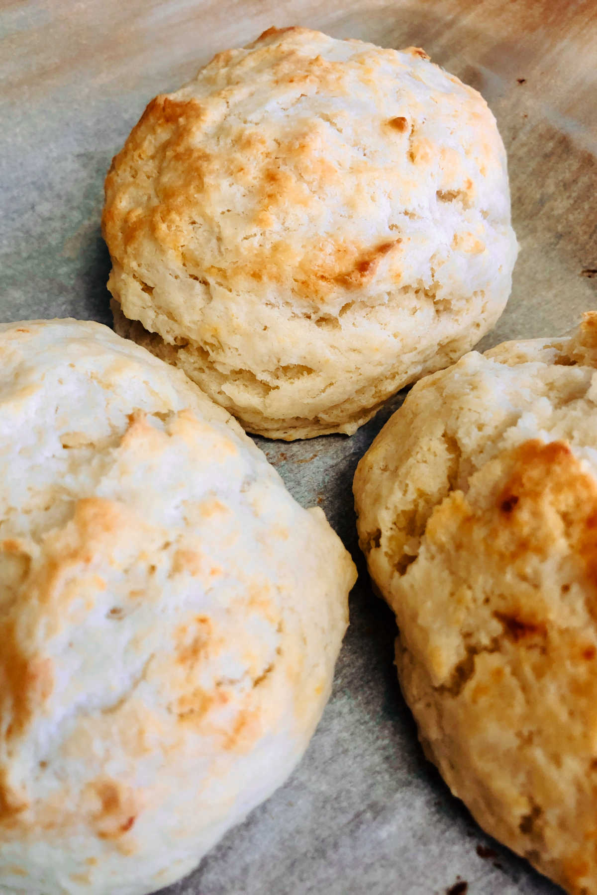 Close up of golden brown freshly baked biscuits.