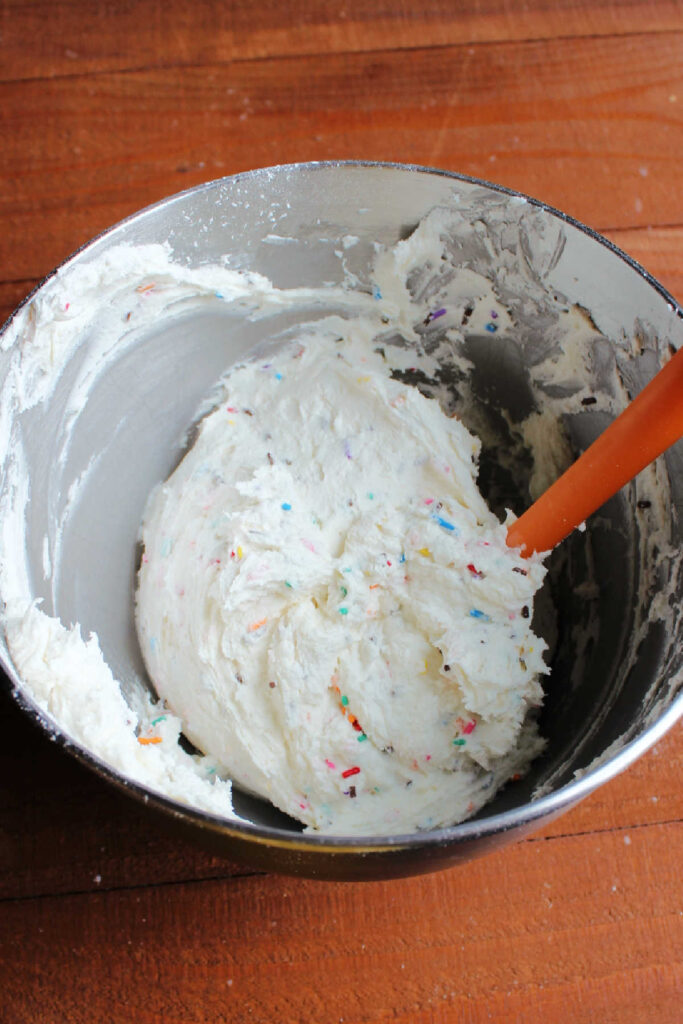 Sprinkles mixed into frosting to make funfetti buttercream.