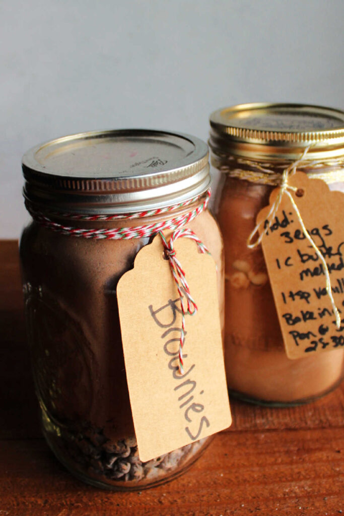 Jars of brownie mix with handwritten tags of instructions on how to make.