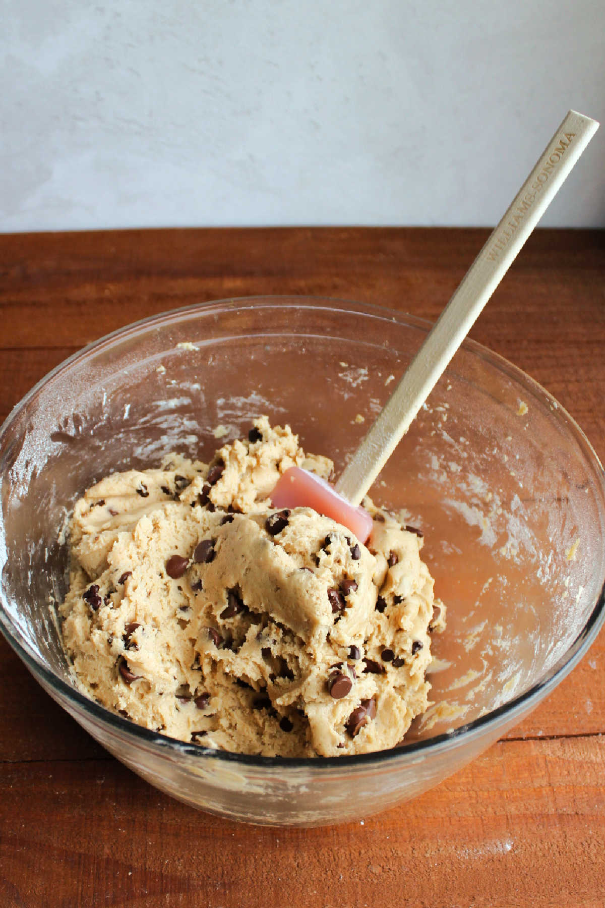Mixing bowl of cookie dough dip with chocolate chips.