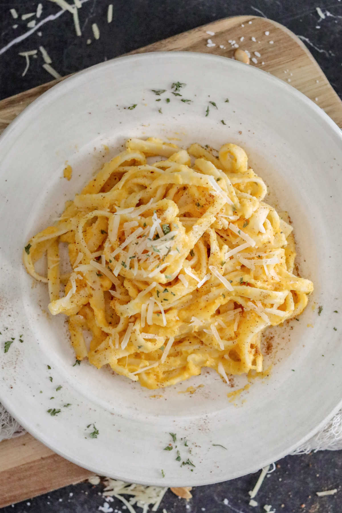 Looking down on a serving of creamy butternut squash alfredo pasta. 