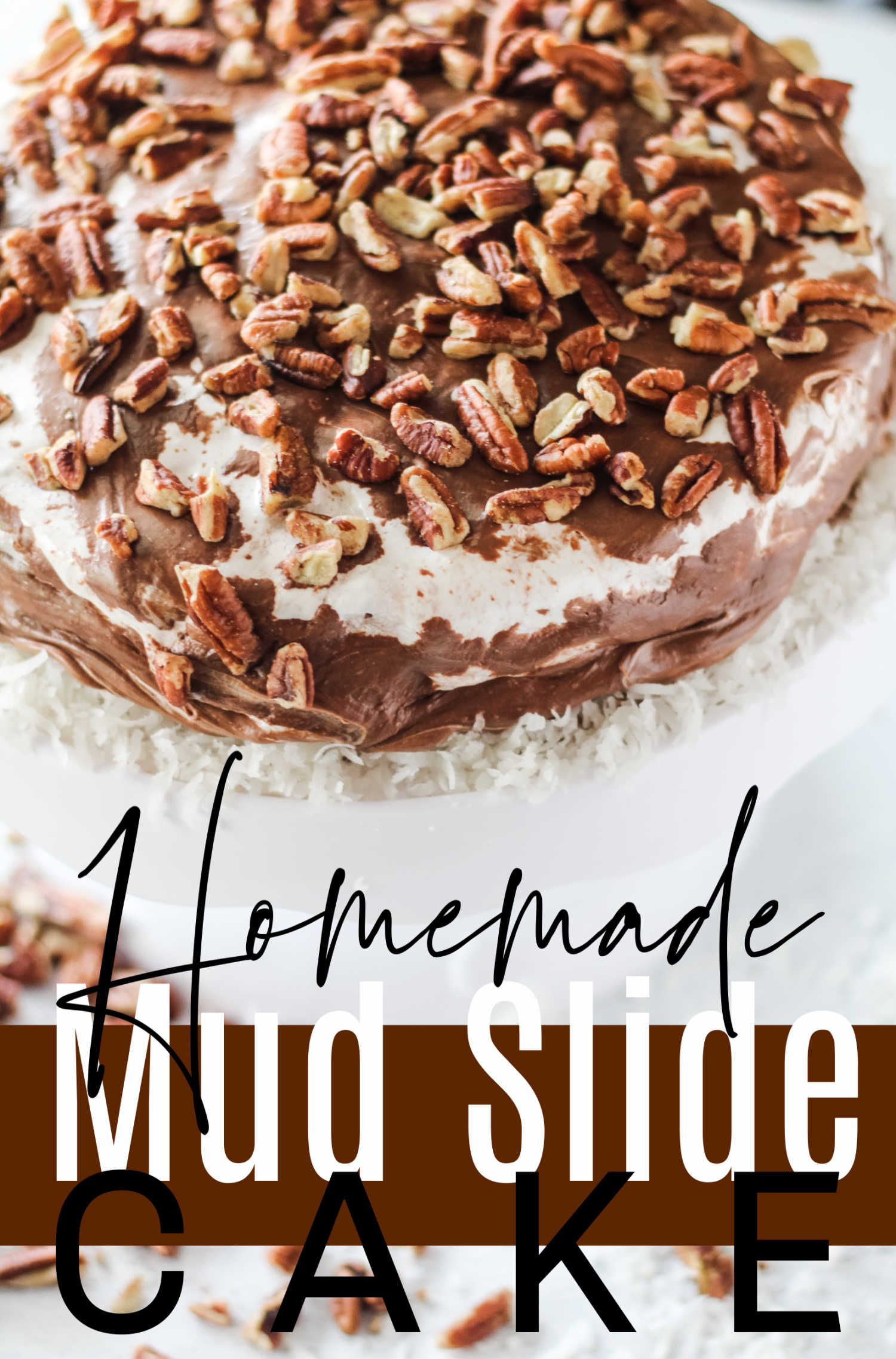 Mississippi mudslide cake pairs a homemade chocolate cake with pecans, coconut, marshmallows and fudgy icing. It is decadent, delicious and loaded with goodness.