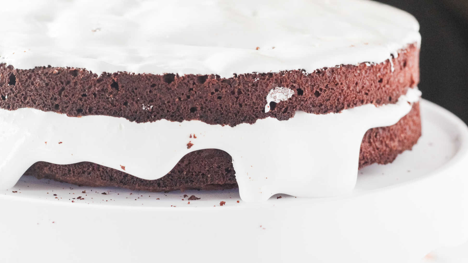 Layers of marshmallow fluff on top of layers of chocolate mudslide cake.