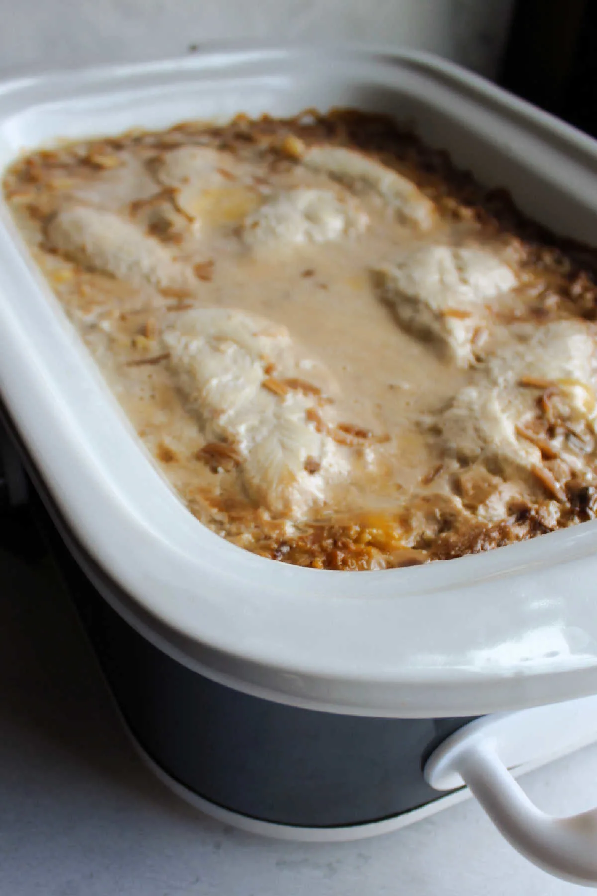 Cook chicken and creamy rice in crockpot, ready to serve.