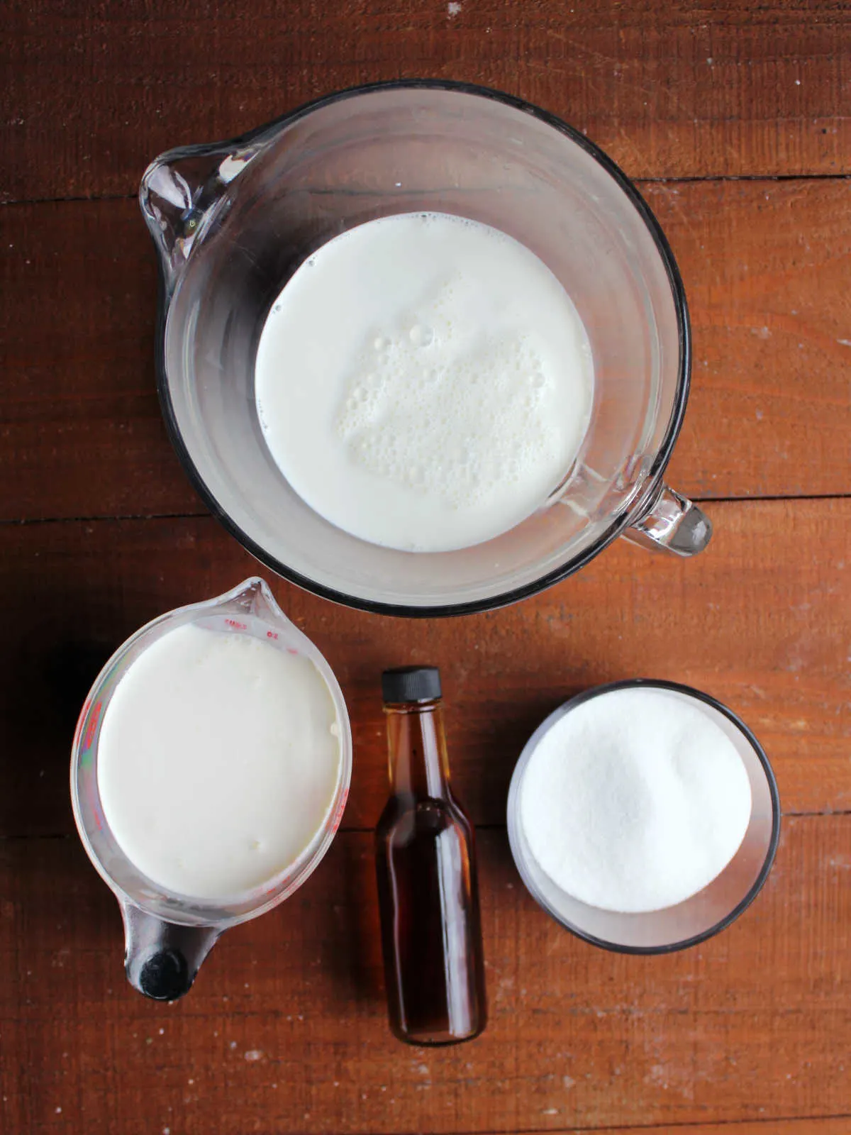 Ingredients for vanilla ice cream including cream, sugar, vanilla, and milk. 
