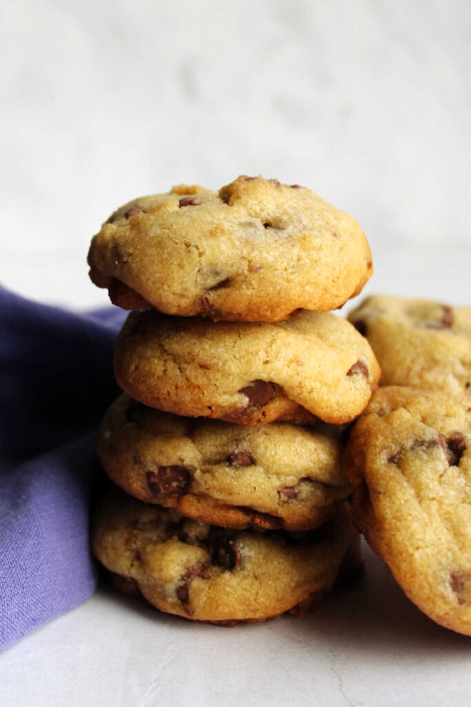 Stack of thick chocolate chip cookies.