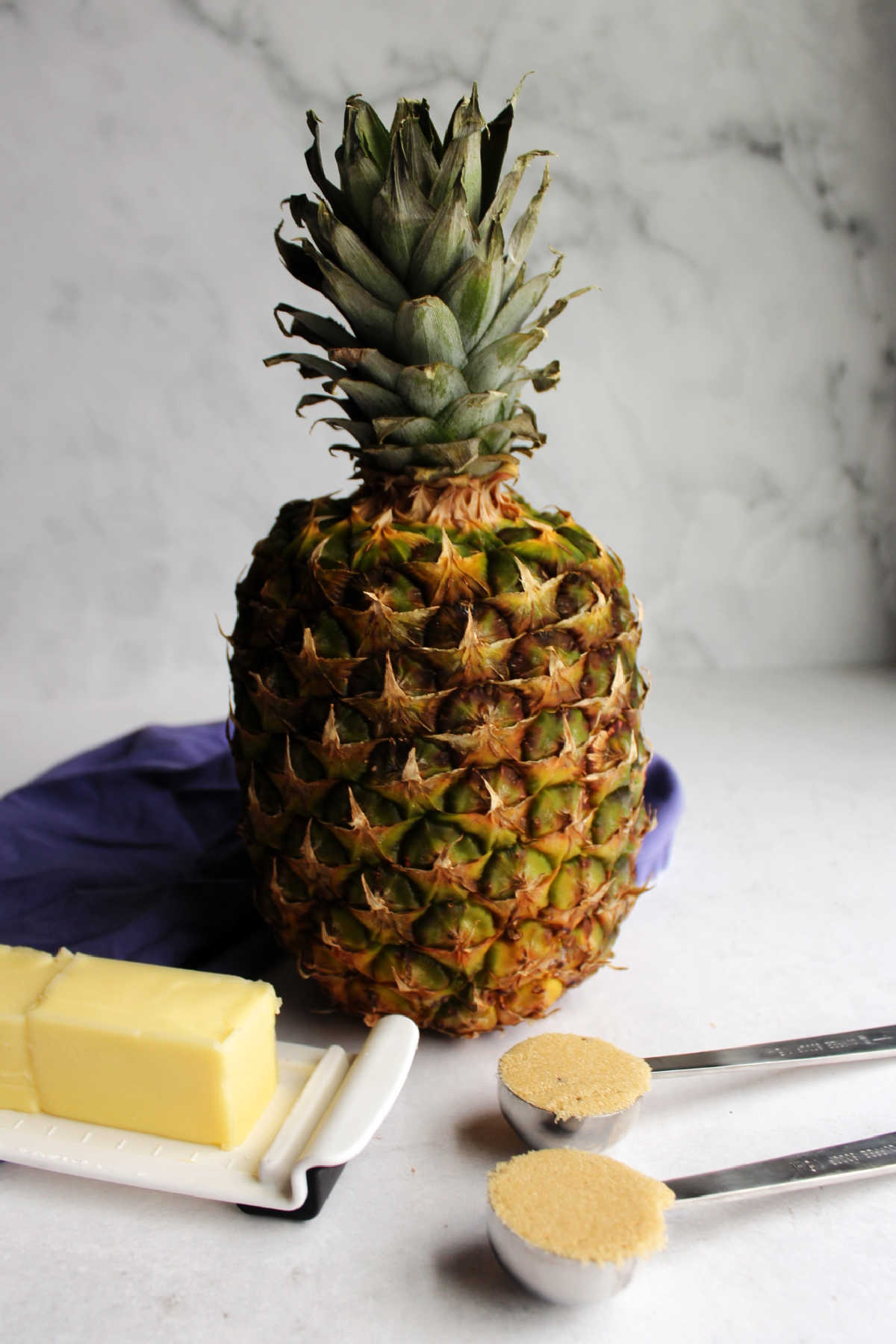 Fresh pineapple, butter and brown sugar ready to be made into air fried pineapple.