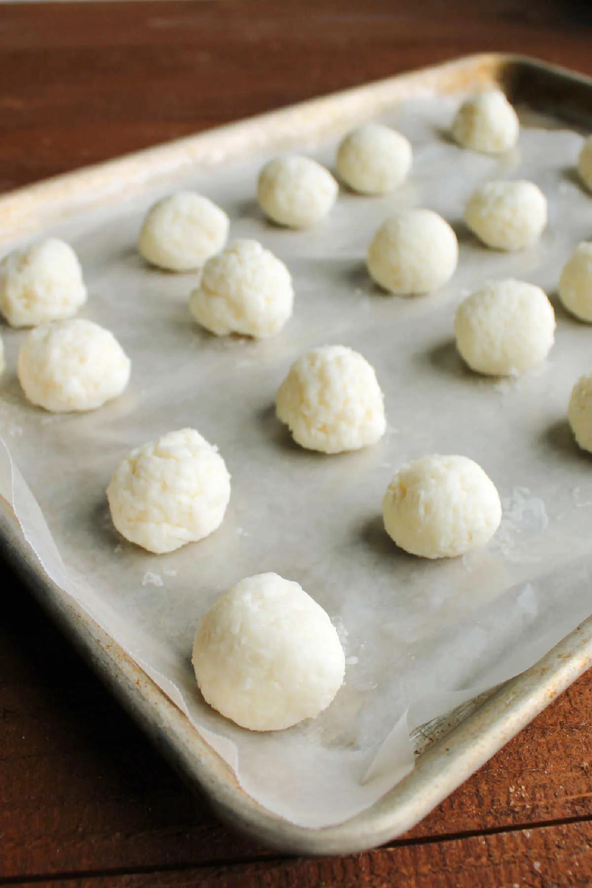 Frozen coconut centers rolled into smooth balls.