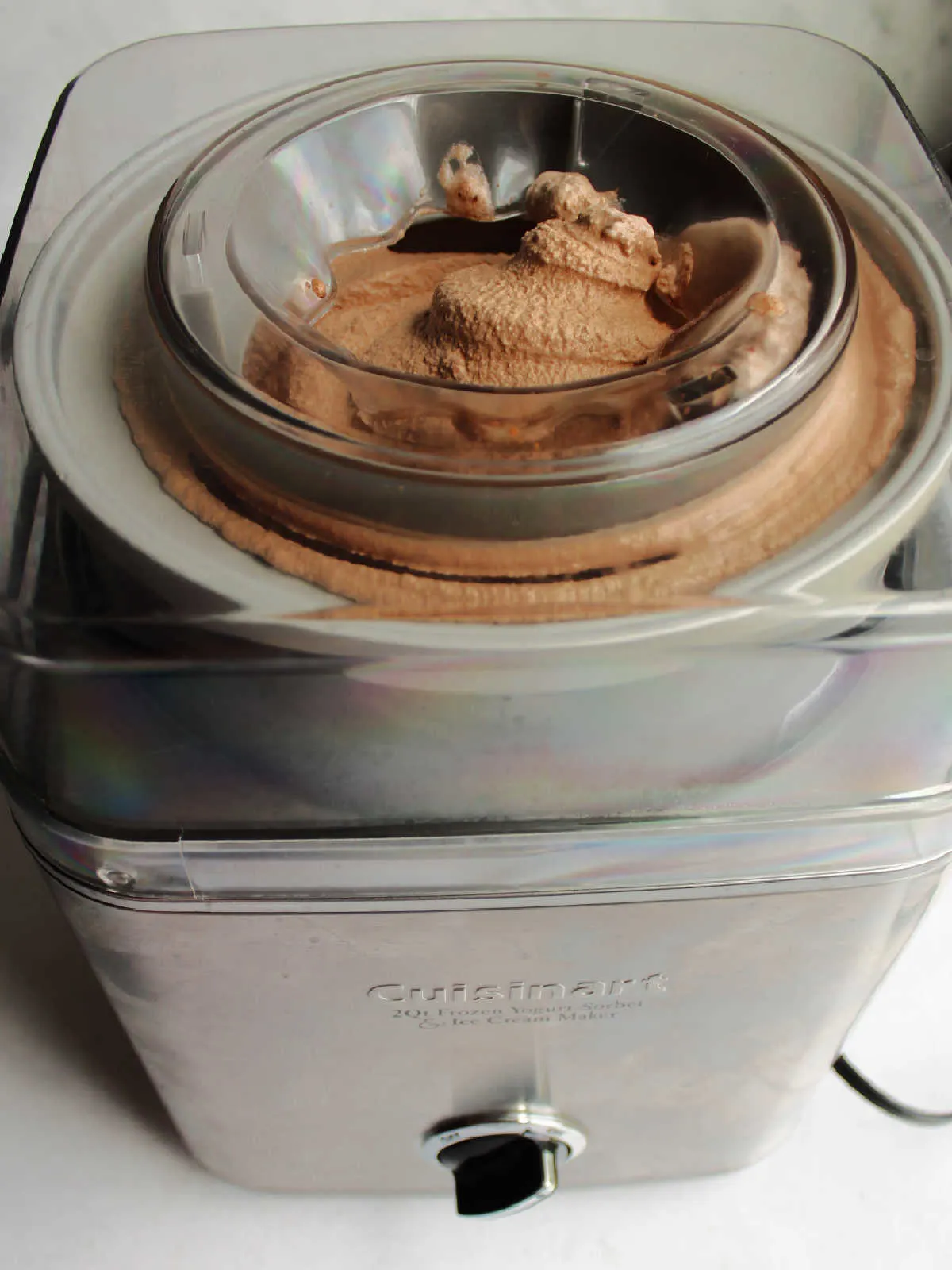 Chocolate ice cream in ice cream maker, ready to go into containers.