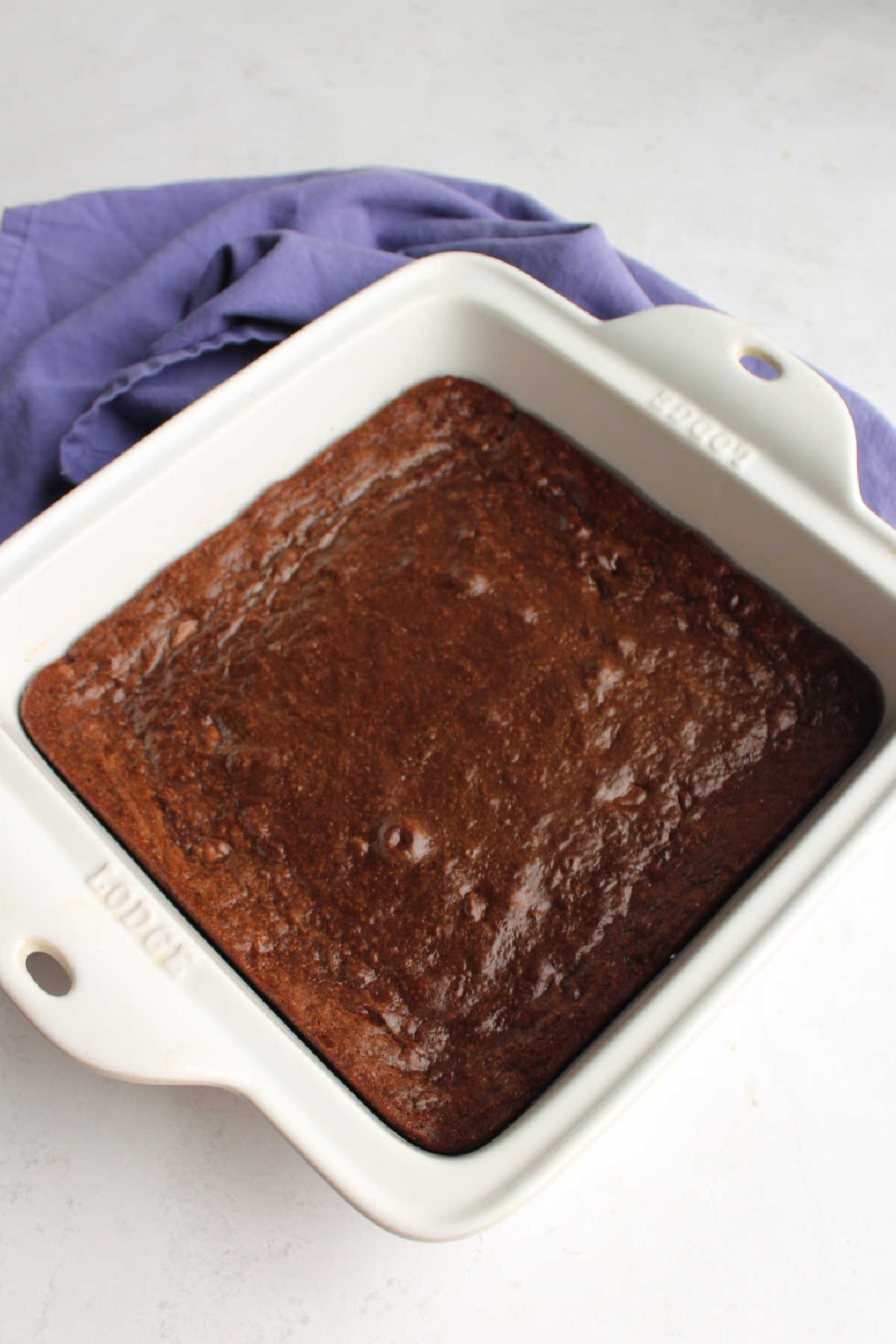 pan of freshly baked brownies with condensed milk baked inside.