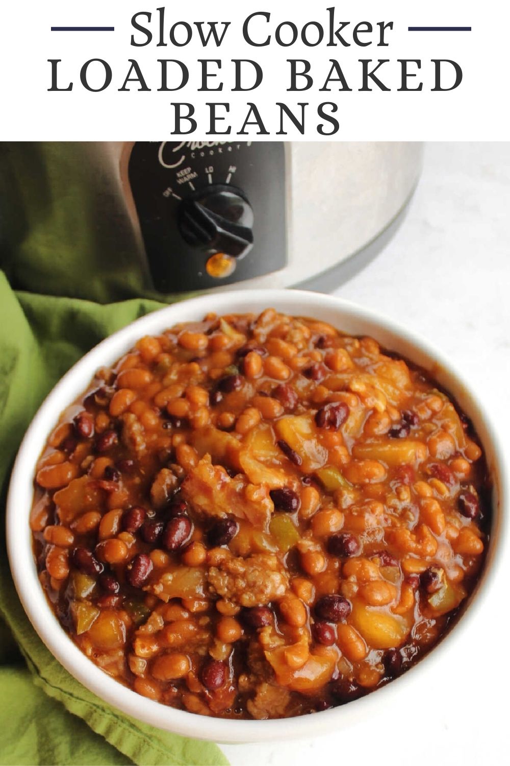 These yummy loaded baked beans are slow cooked to perfection. They have slices of bacon, bits of sausage, a tasty sweet and spicy sauce and even a secret ingredient you would never guess.