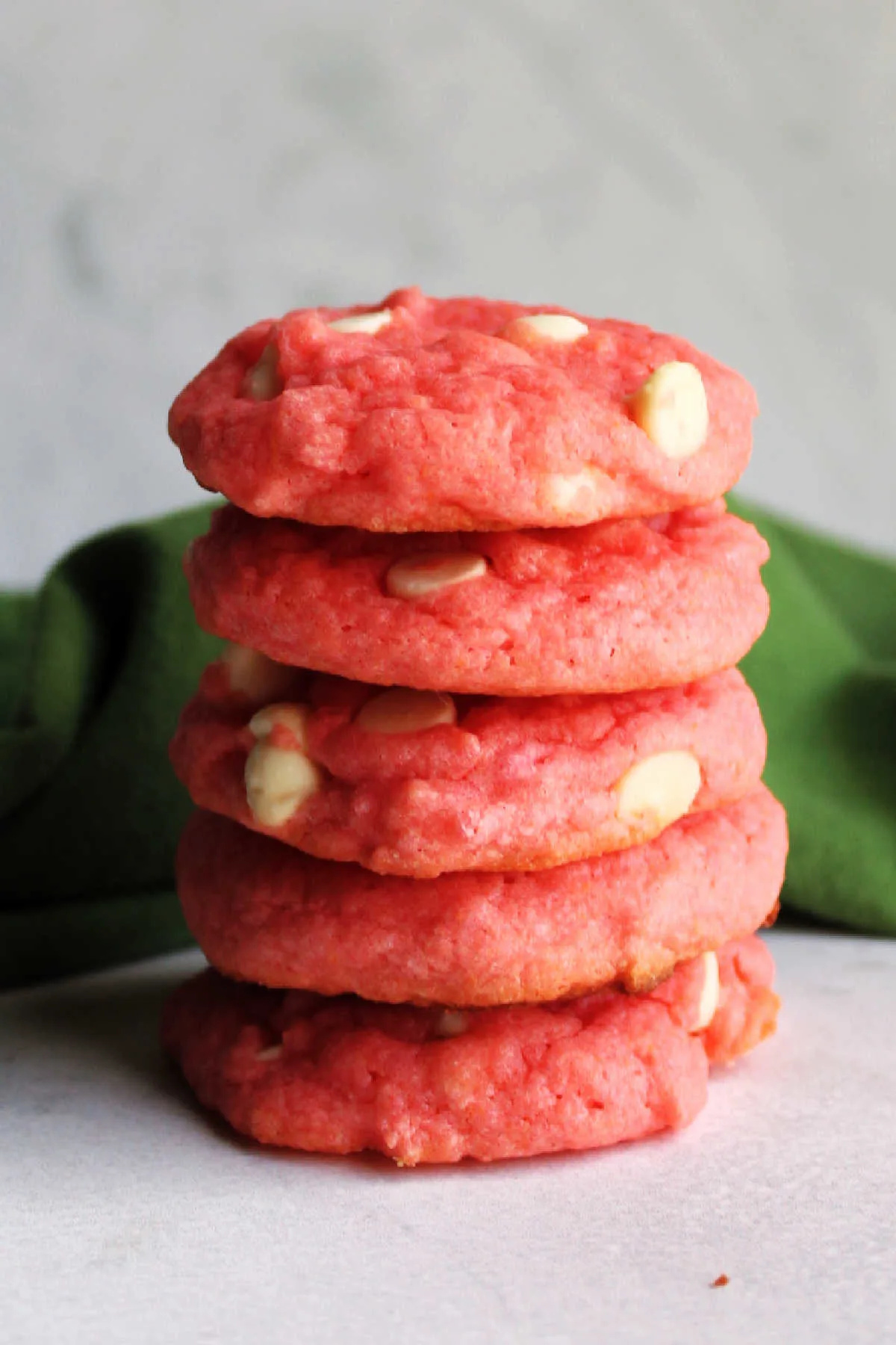Stack of pink strawberry cake mix cookies.
