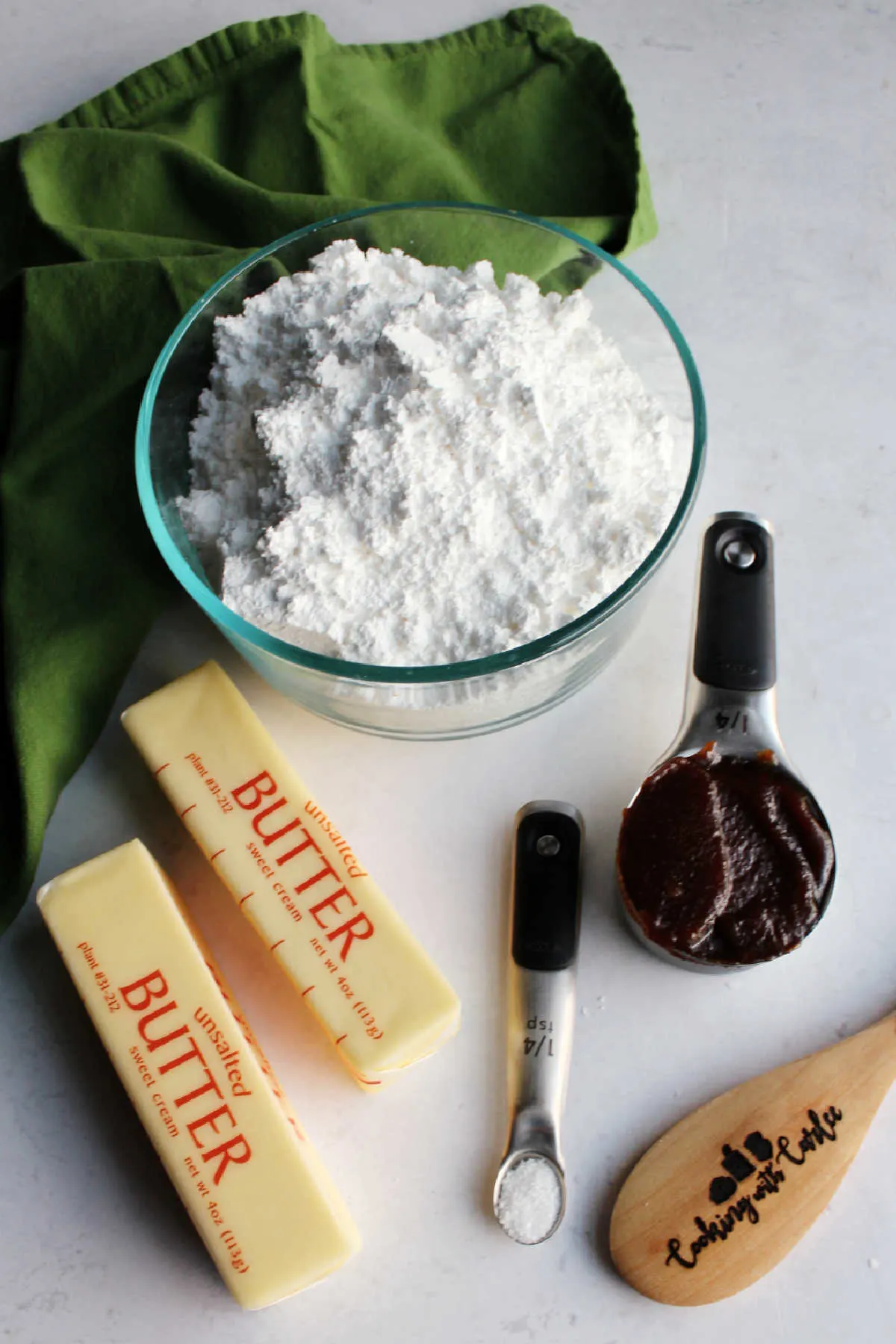 Ingredients: butter, salt, apple butter and powdered sugar ready to be made into frosting.