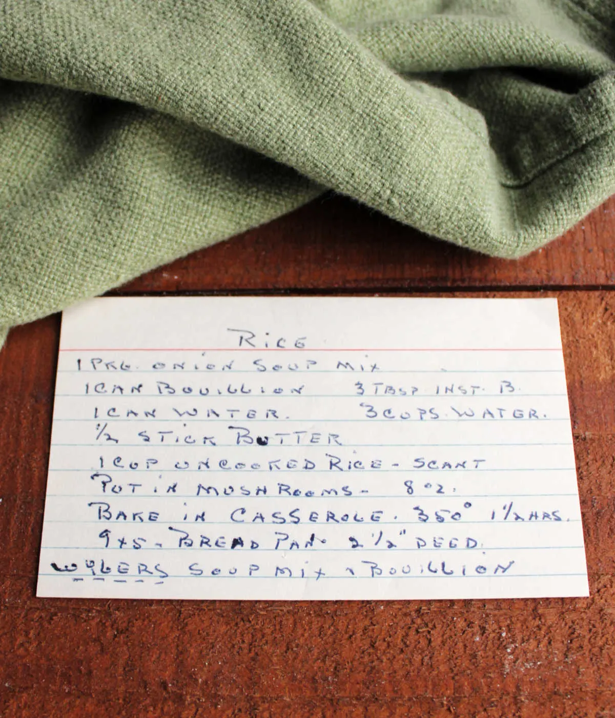 Slightly yellowed index card with hand written recipe for "rice" on it.