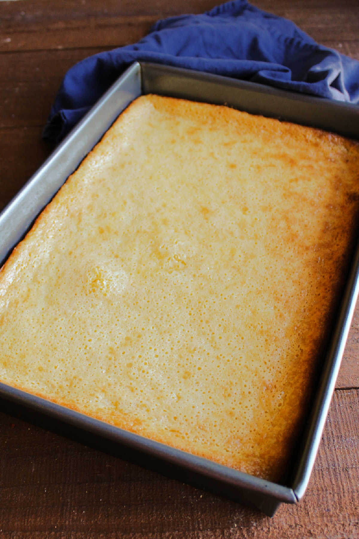 Lemon gooey butter cake fresh from the oven, with golden brown edges and gooey center.