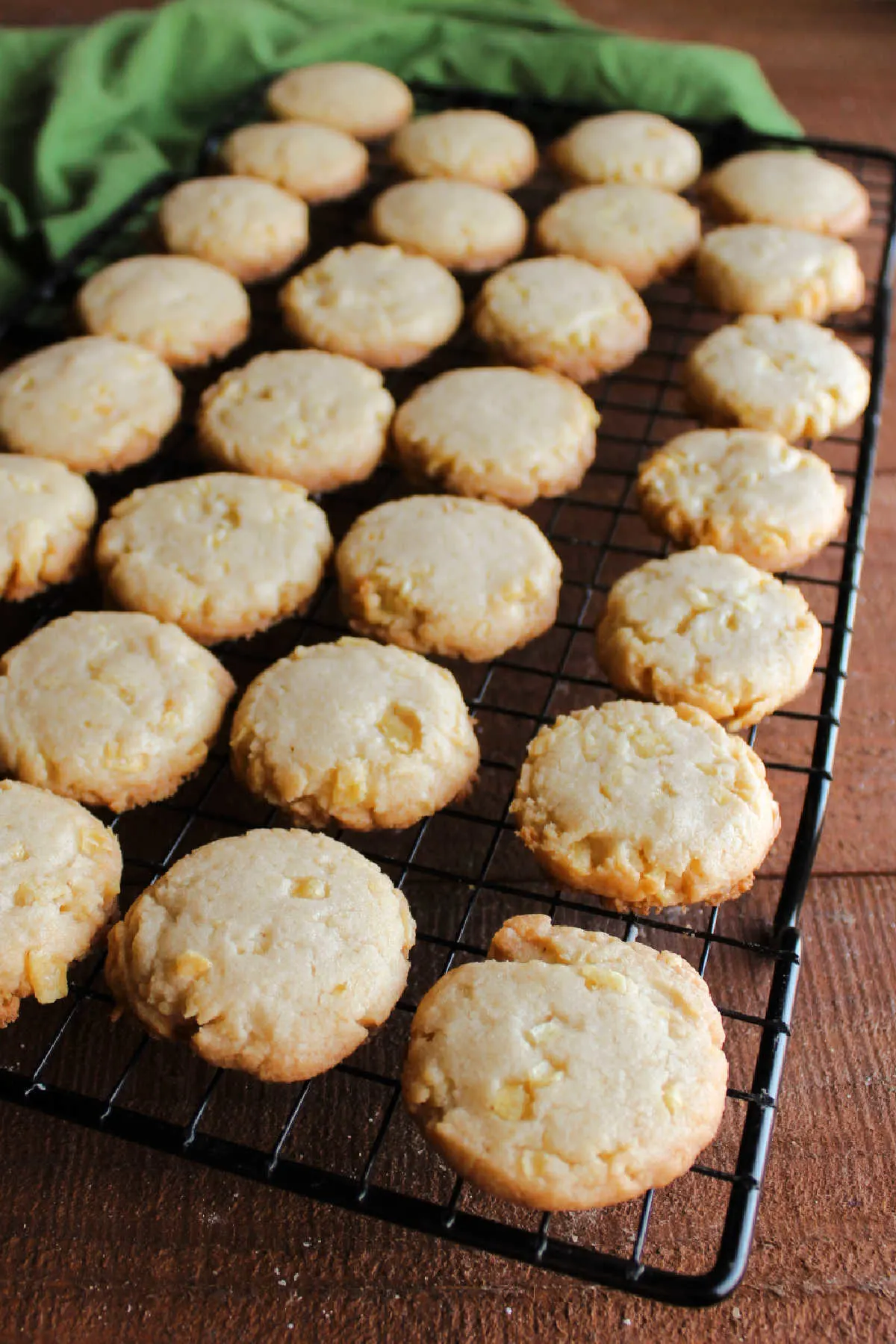 Potato chip cookies with golden brown edges cooling on wire rack.