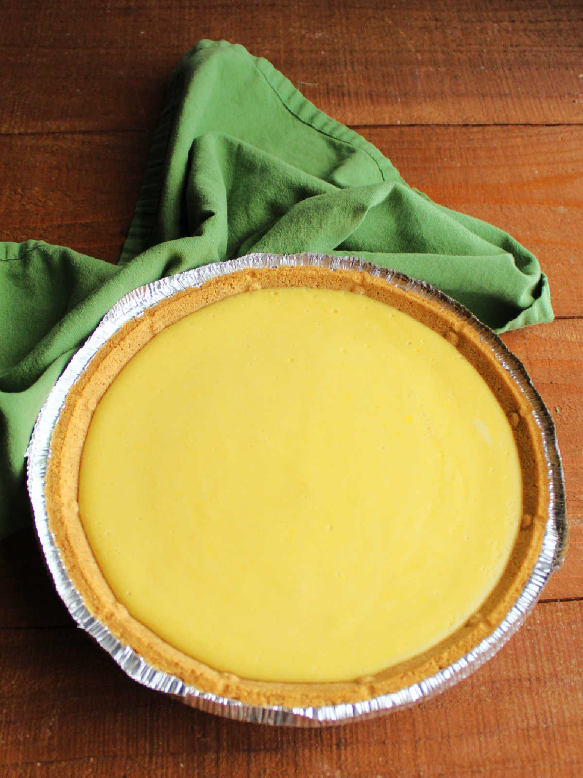 Baked condensed milk key lime pie fresh from the oven, ready to chill.