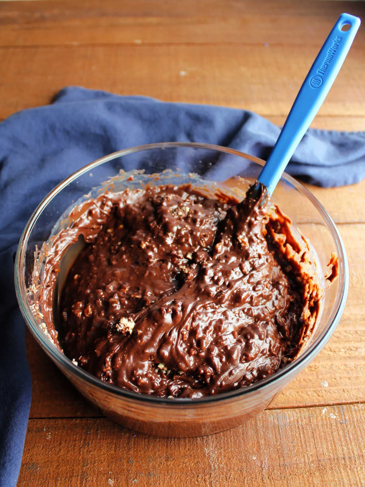 Chopped pecans stirred into chocolate and condensed milk mixture. 