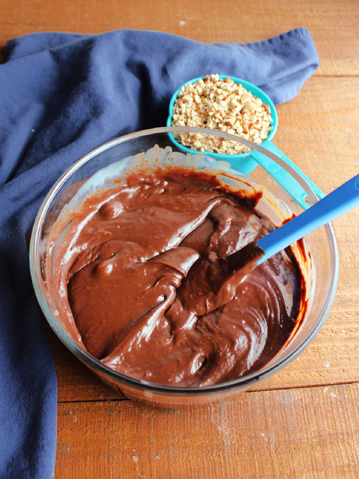 Mixing bowl with melted chocolate and condensed milk mixture inside.