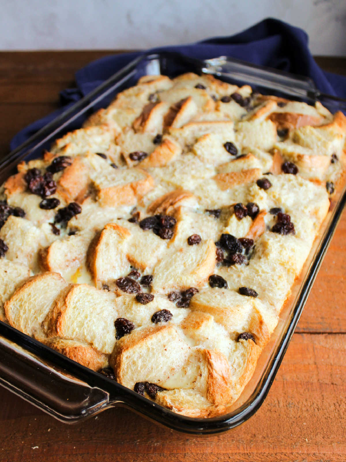 Baked condensed milk bread pudding showing how it puffed up and the top got golden in the oven.
