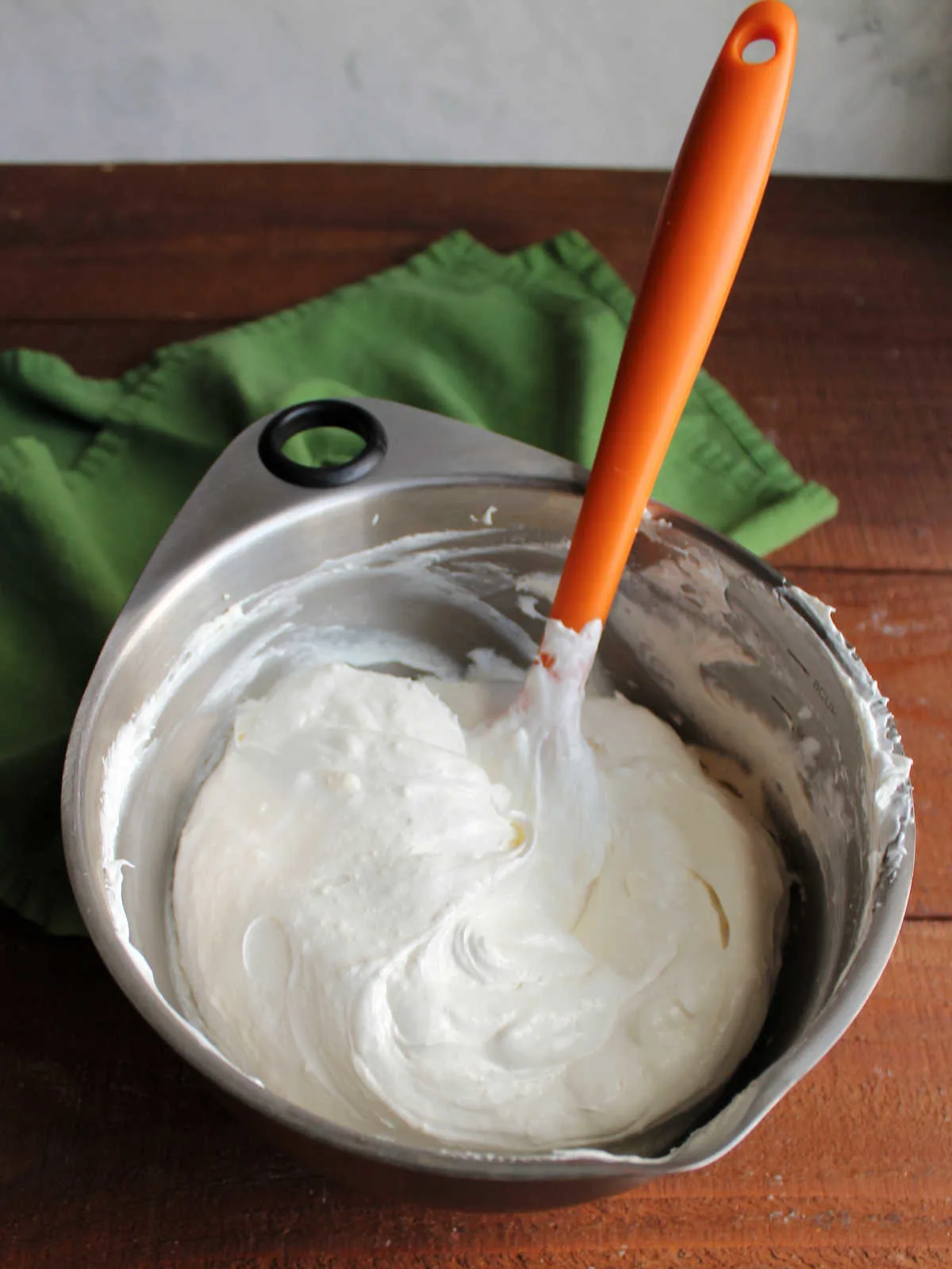 Mixing bowl filled with cream cheese and whipped topping mixture.