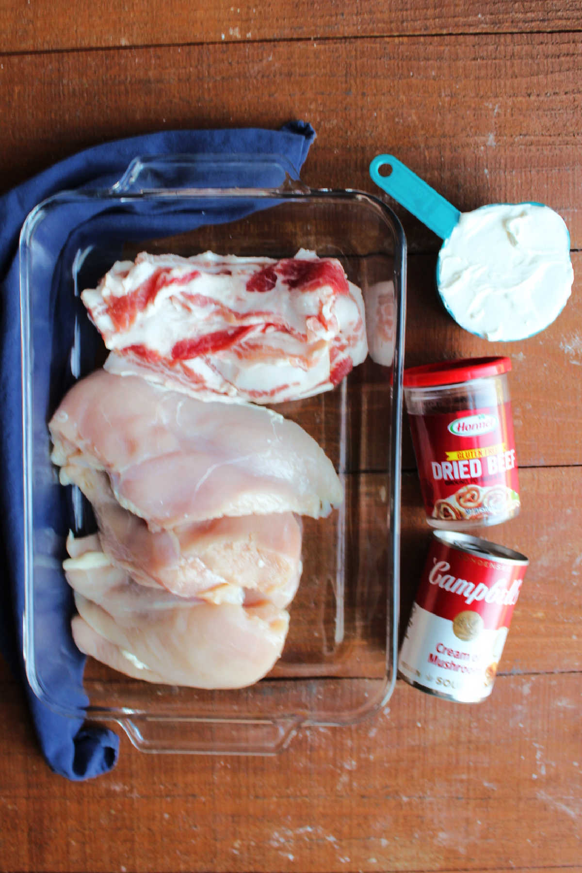 Ingredients including boneless skinless chicken breasts, bacon, dried beef, cream of mushroom soup, and sour cream.