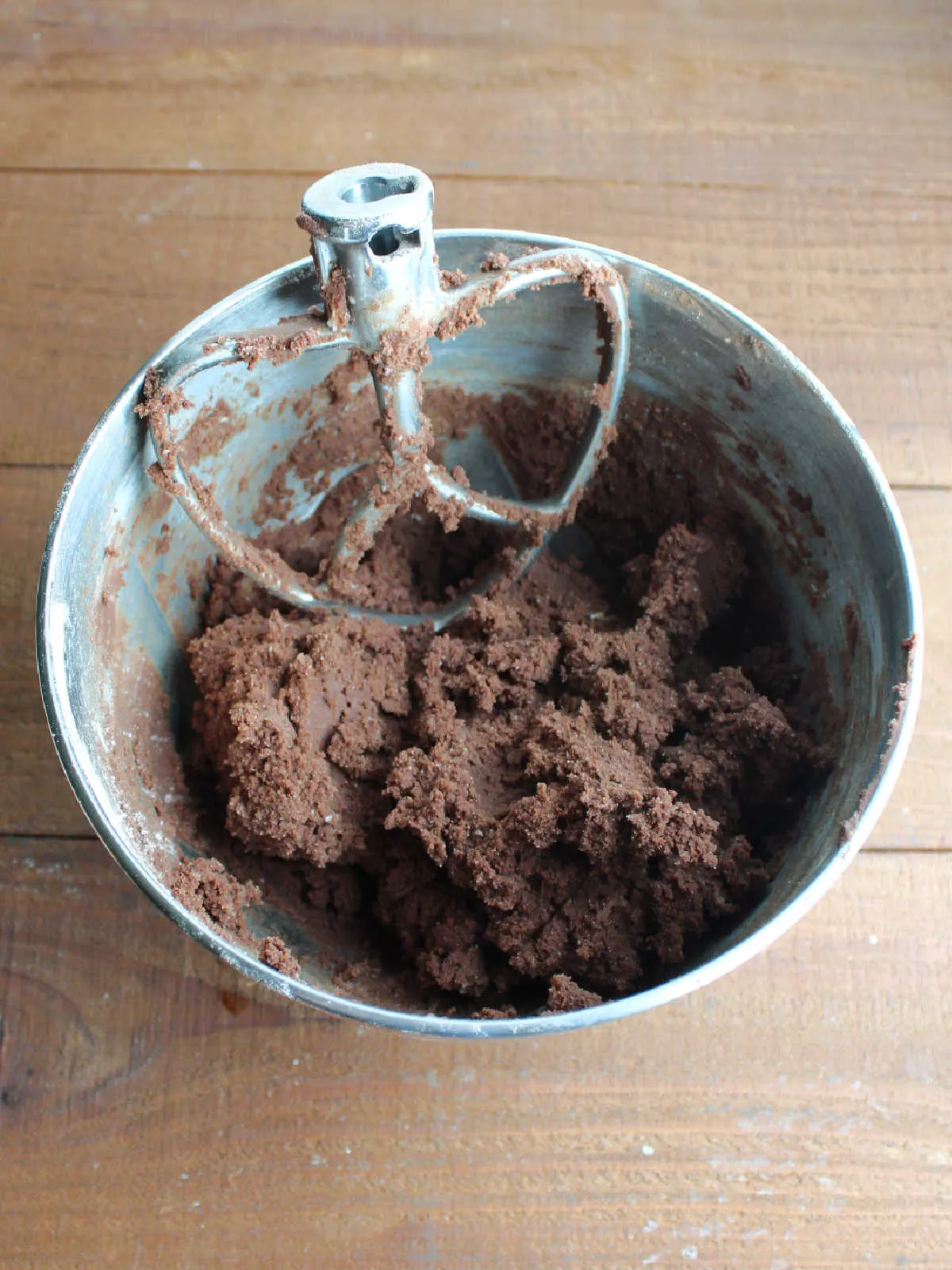 Mixer bowl with soft chocolate cookie dough ready to be scooped.