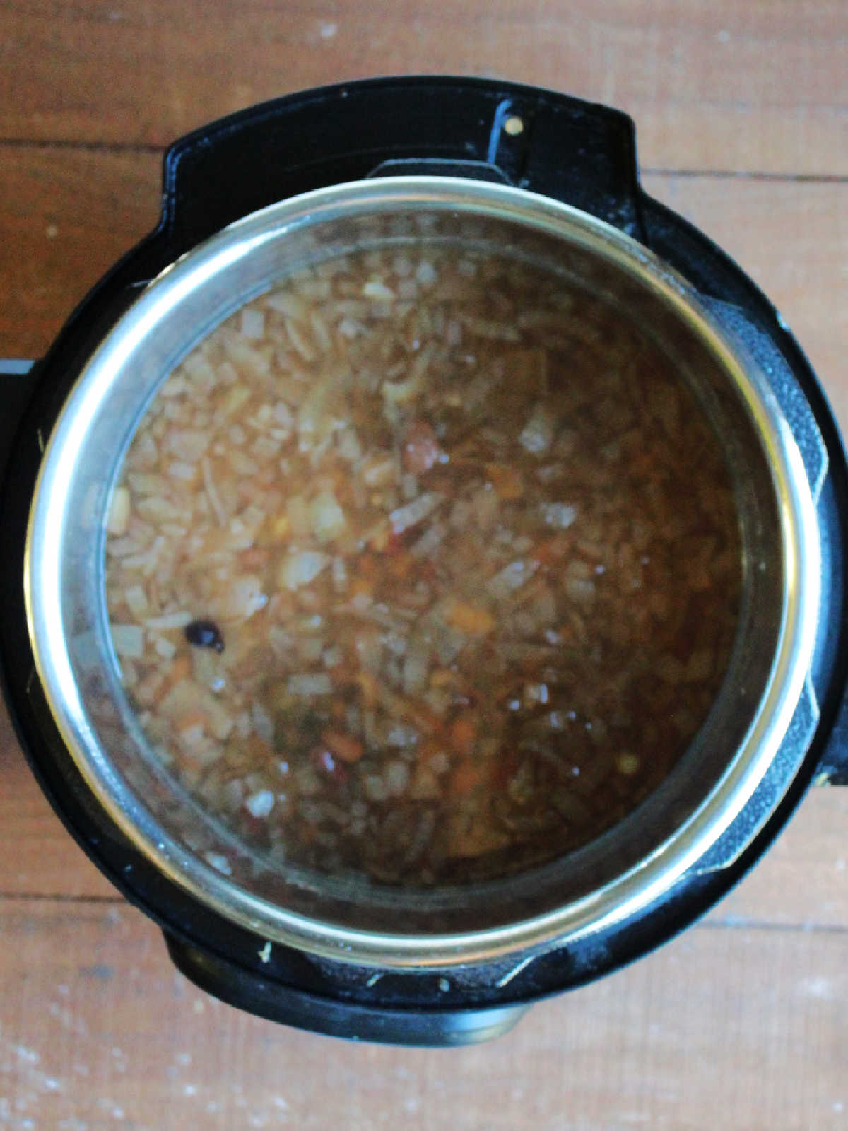 Mostly cooked bean soup in Instant Pot, ready for sausage and tomatoes.