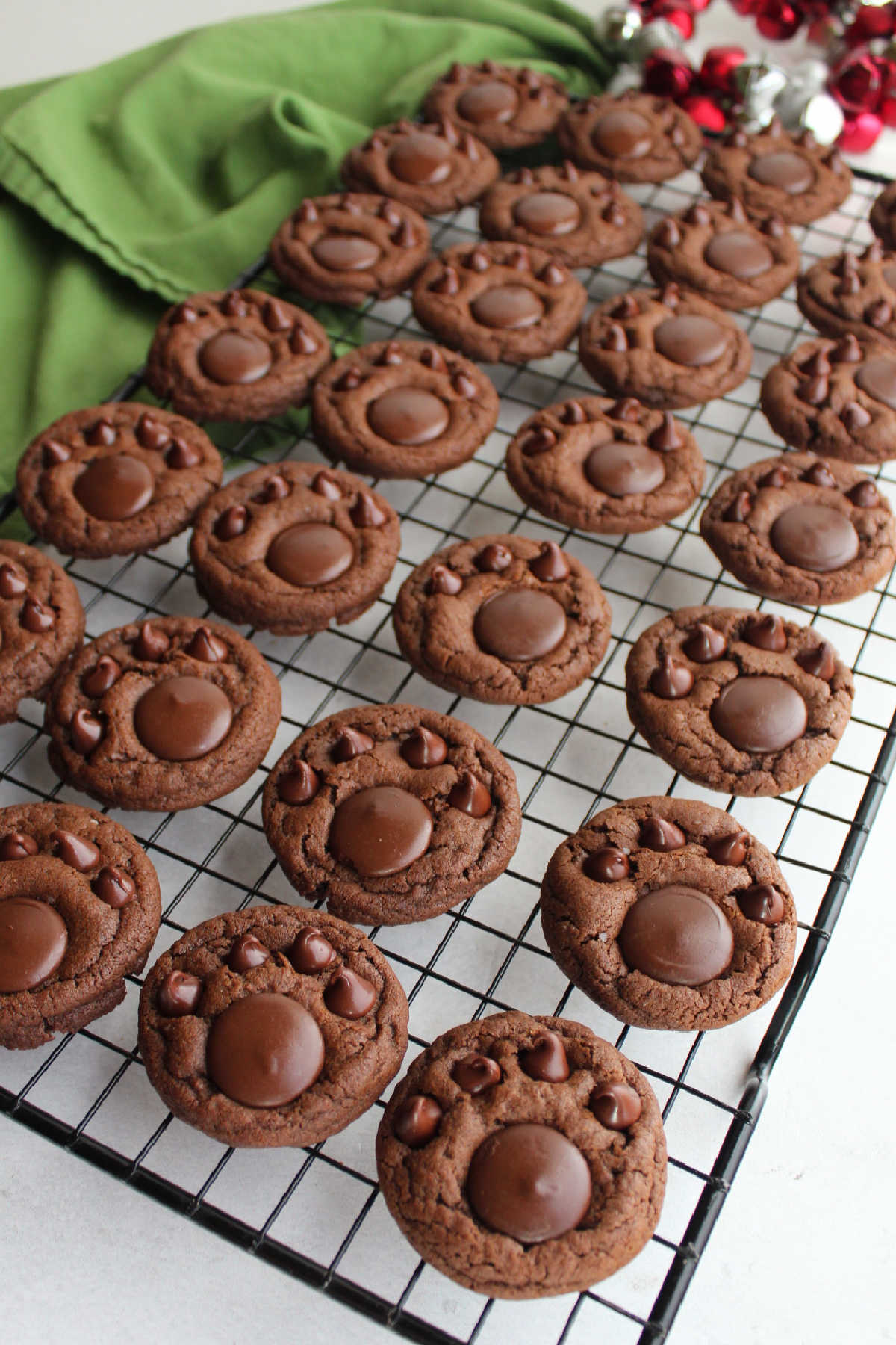 Chocolate paw print cookies on wire cooling rack.