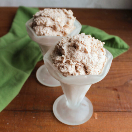 Copycat Chocolate Frosty 2 Two ice cream sundae cups filled with frozen homemade chocolate frosty mixture.