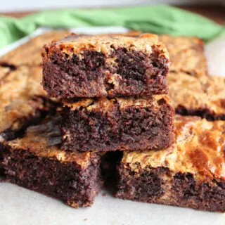 Brownie mix brownies with caramelized condensed milk swirl cut into pieces and stacked on top of each other.