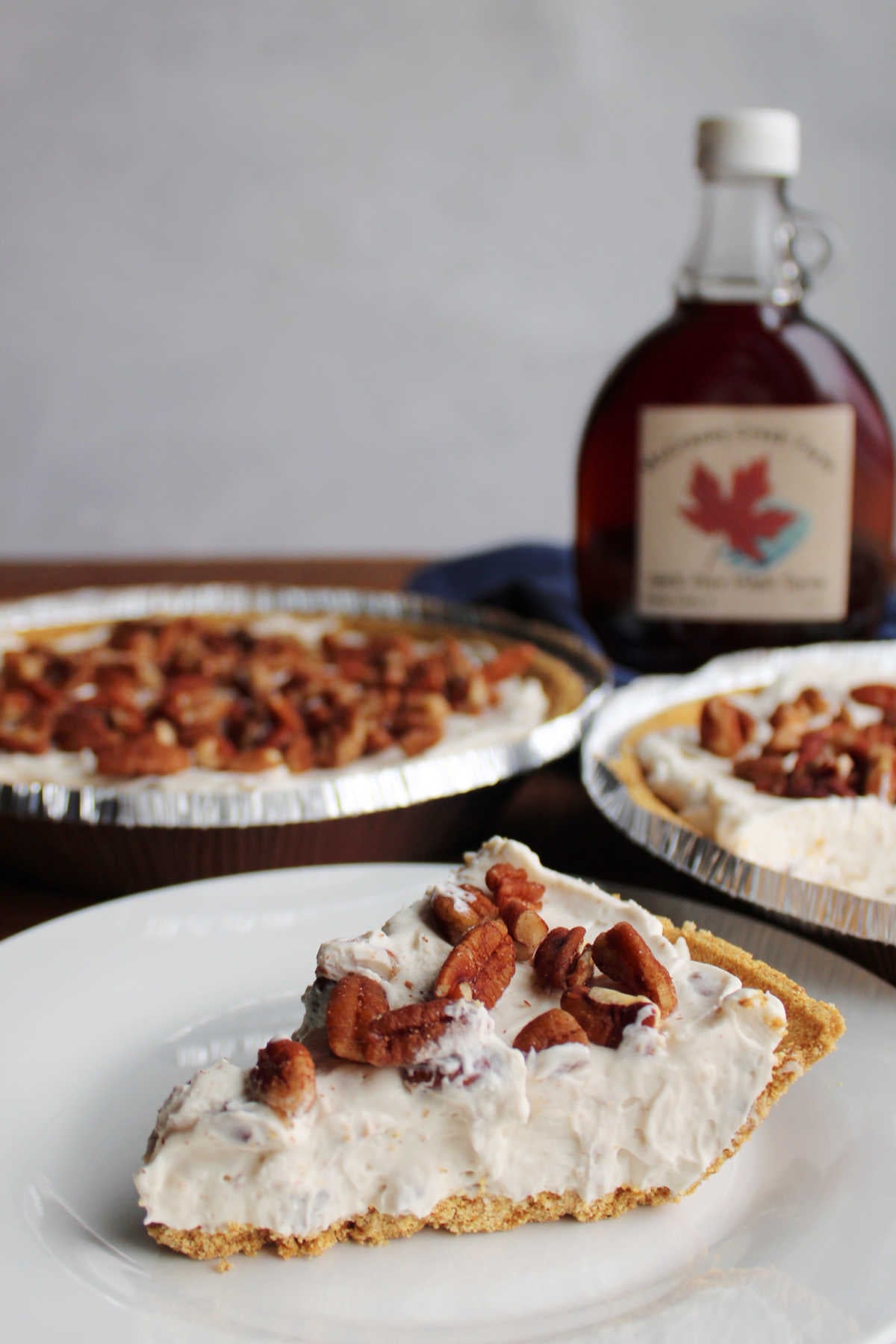 No Bake Pecan Cream Pie 13 Slice of creamy no bake pecan cream cheese pie topped with toasted pecans, ready to eat.