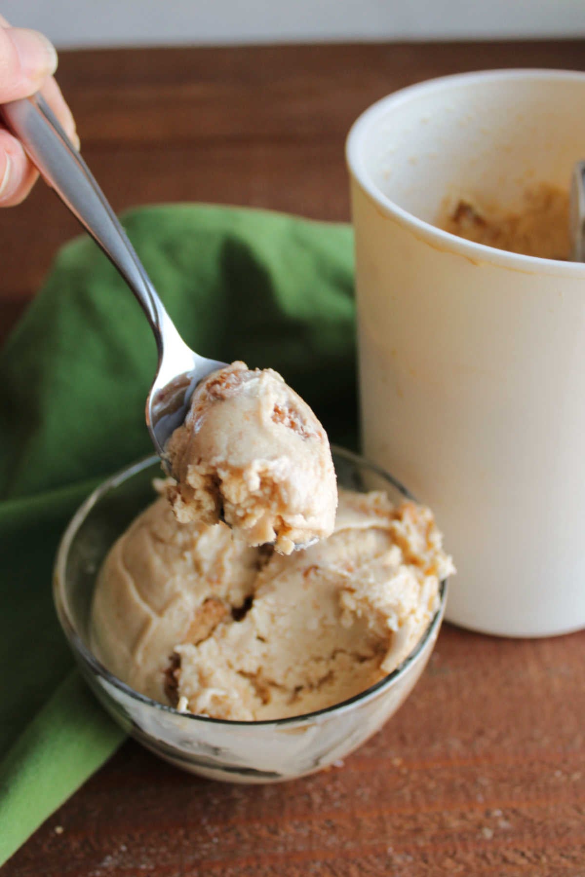Biscoff Ice Cream 7 Spoon with a bite of biscoff ice cream showing light tan cookie butter base with chunks of biscoff cookies mixed in.