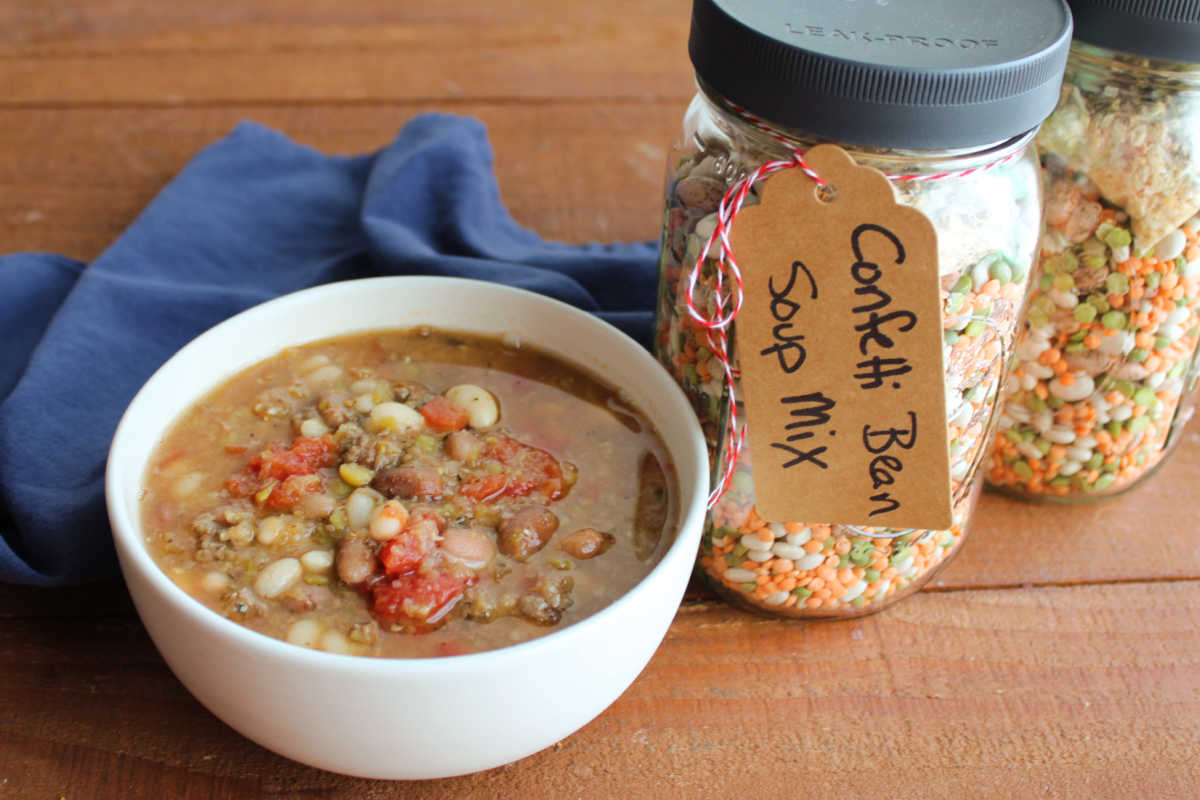 Confetti Bean Soup Mix In A Jar 7 Bowl of confetti bean soup next to jars of the mix it was made from.