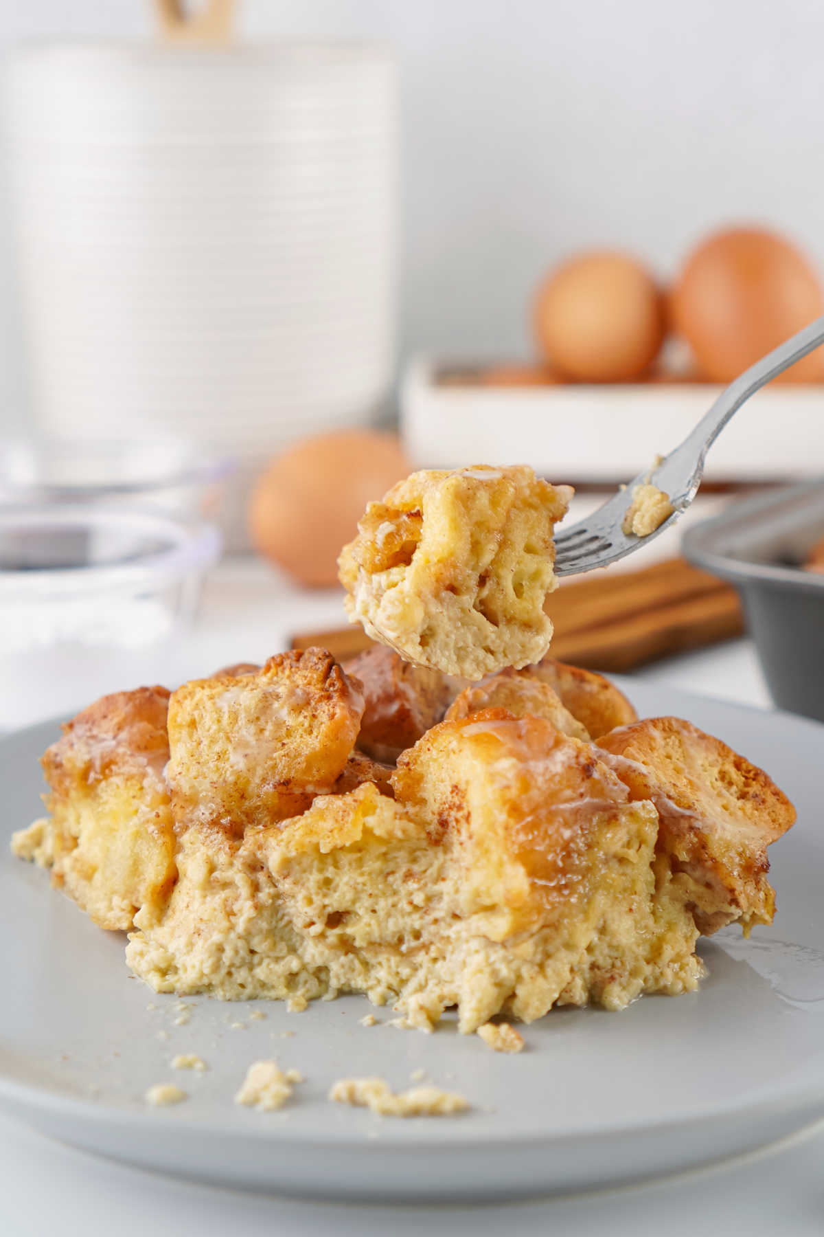 Donut Bread Pudding 9 Bite of donut bread pudding on fork, ready to eat.