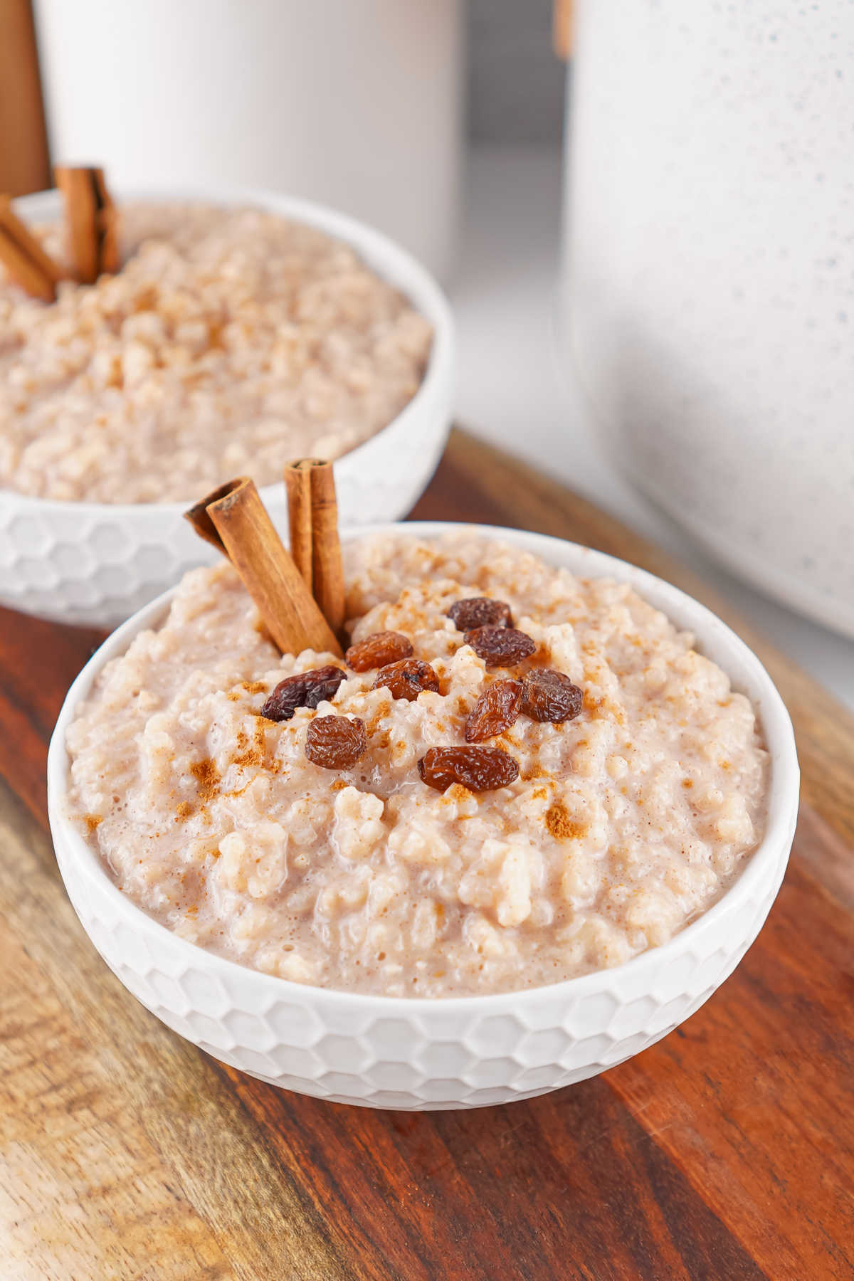 Bowls of cream rice pudding made from instant rice in a slow cooker, ready to be enjoyed. 