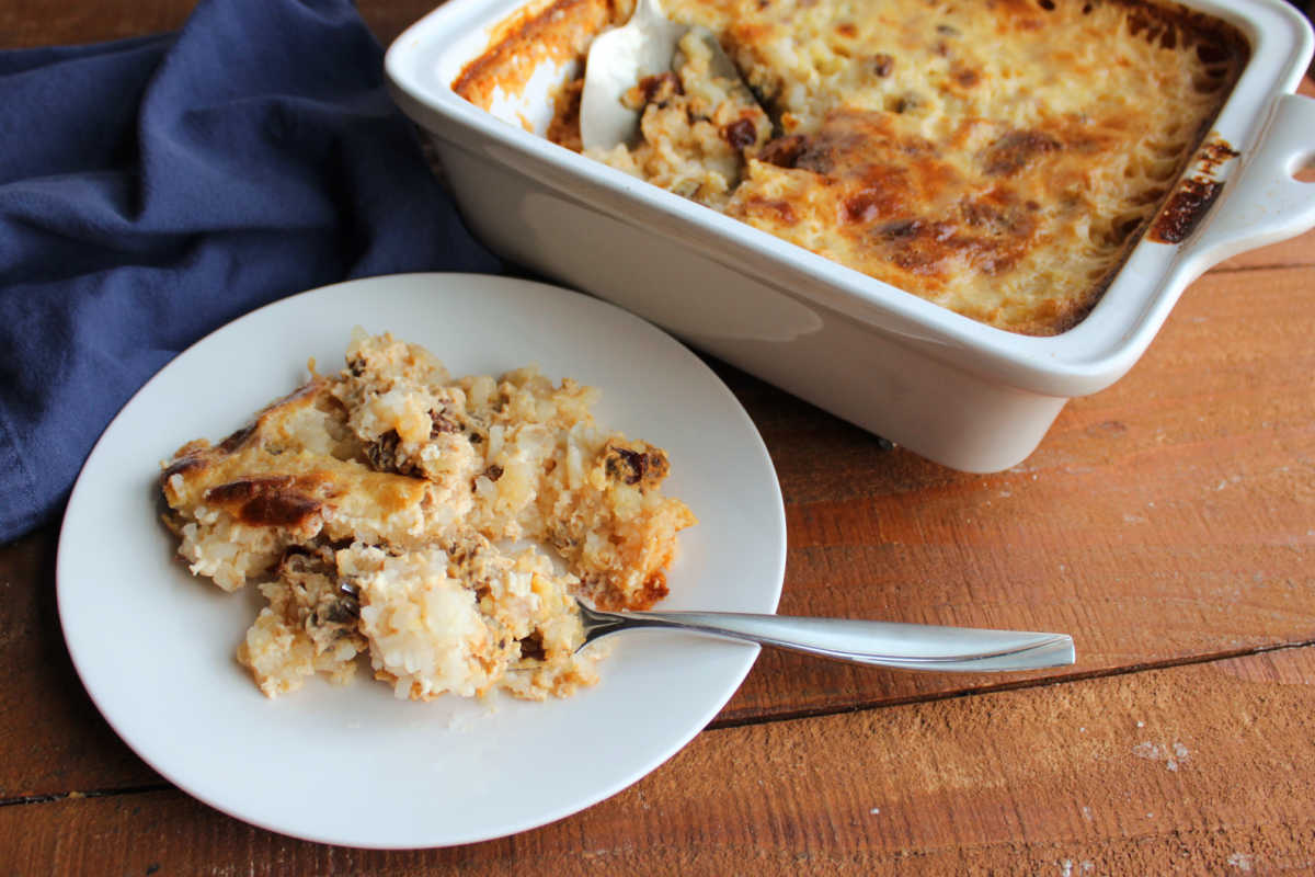 Baked Rice Pudding With Uncooked Rice 6 Plate of baked rice pudding next to the dish it was baked in, ready to eat.
