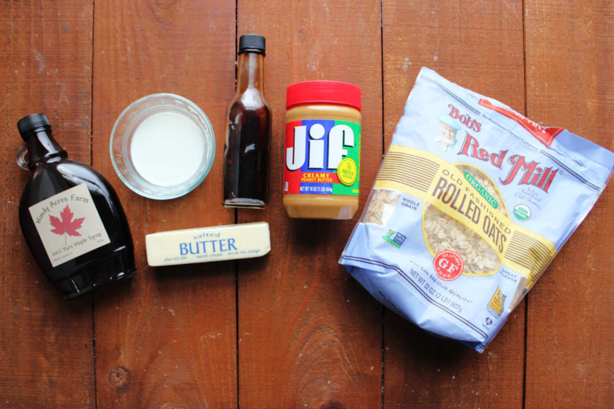 Ingredients including maple syrup, milk, vanilla, butter, peanut butter, and old fashioned oats ready to be made into maple no bake cookies. 