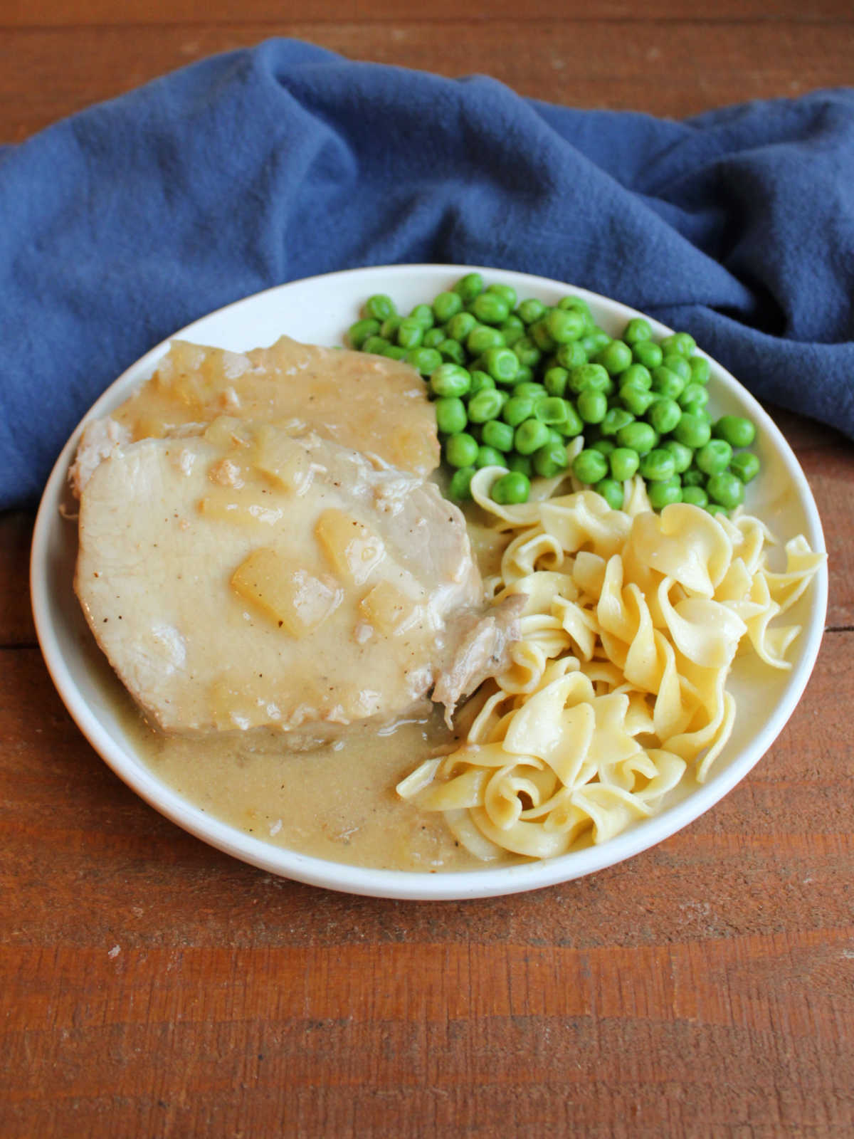 Pork loin slices covered in honey mustard gravy served with buttered noodles and peas. 