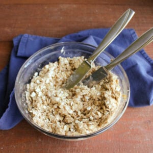Bowl of brown sugar and oat mixture ready to go on the crisp.