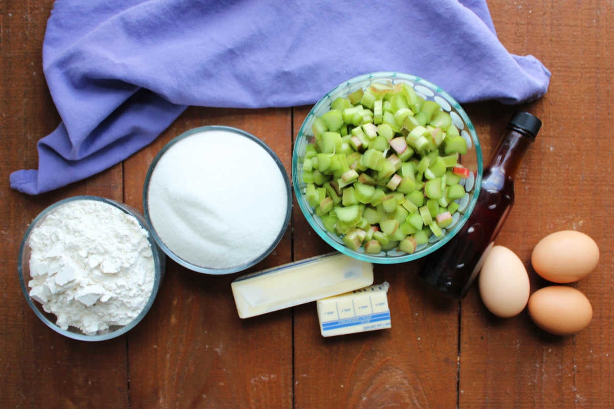 Rhubarb Snack Cake 6 Ingredients including flour, sugar, rhubarb, butter, eggs and vanilla ready to be made into a rhubarb snack cake.