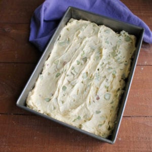 Rhubarb Snack Cake 14 Thick rhubarb snack cake batter spread in greased 9x13-inch pan, ready for the oven.