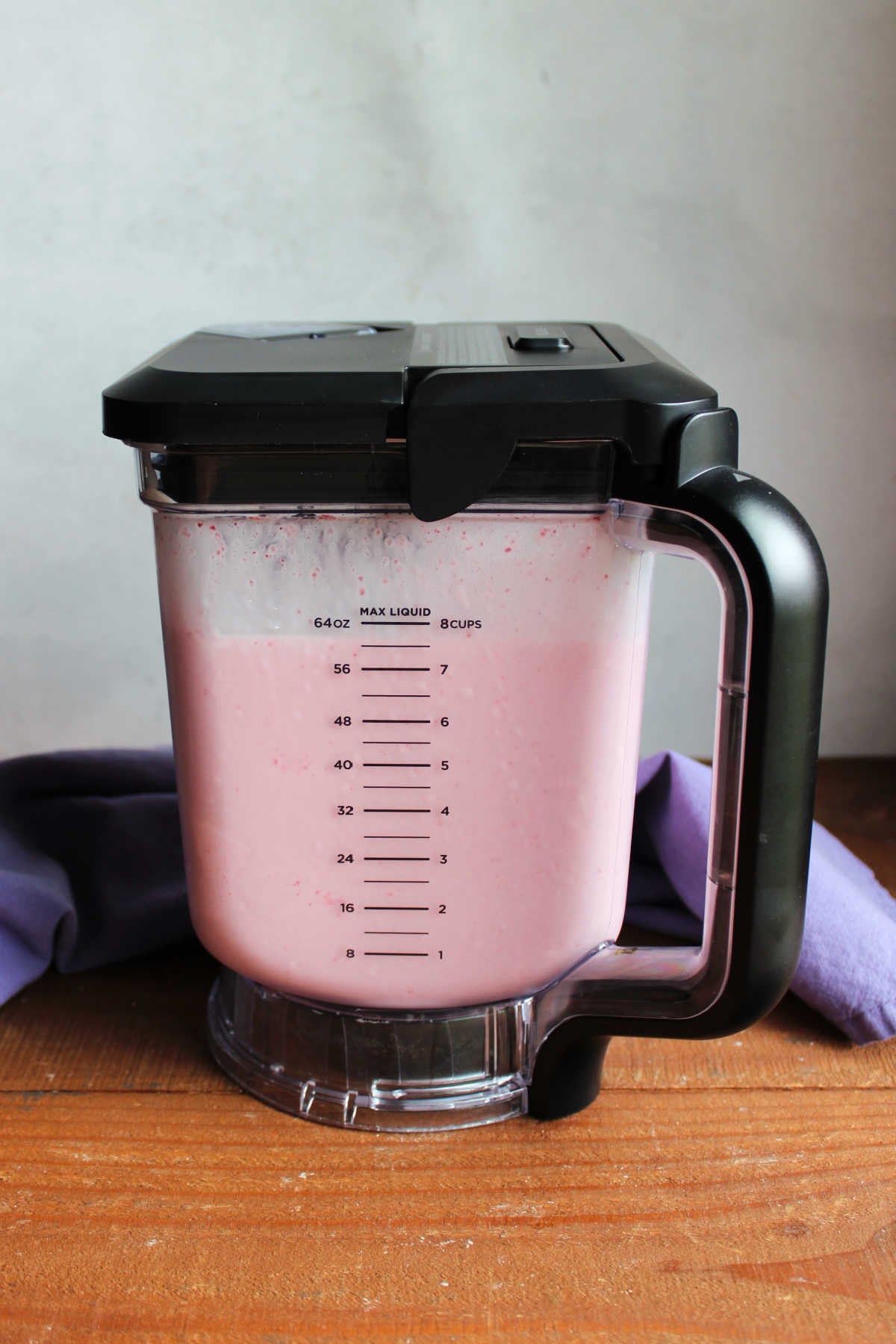 Homemade Strawberry Ice Cream Without Eggs 8 Blender filled with strawberry ice cream base ready to go in the ice cream churner.